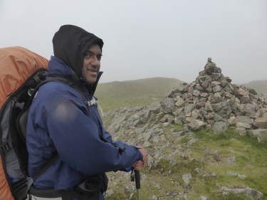 Nas reaches the summit of Crag Fell.